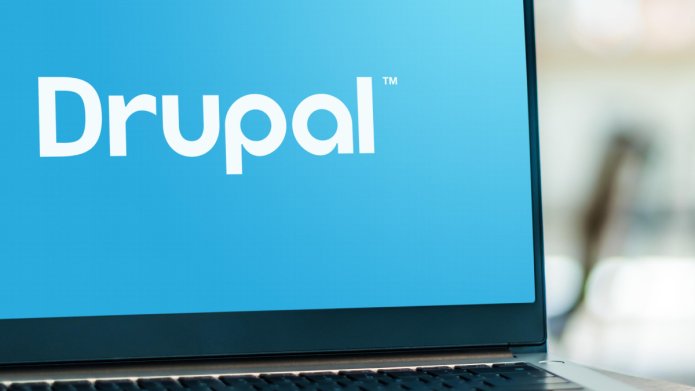 Laptop with Drupal written in white on a blue background